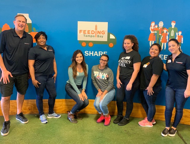 Group of 7 Rubenstein Law Personal Injury staff at Tampa Bay Food Bank